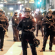 Police in riot gear stand guard outside City Hall during a protest against President-elect Donald Trump in Los Angeles, Nov. 13, 2016. RINGO CHIU/AFP/Getty Images)